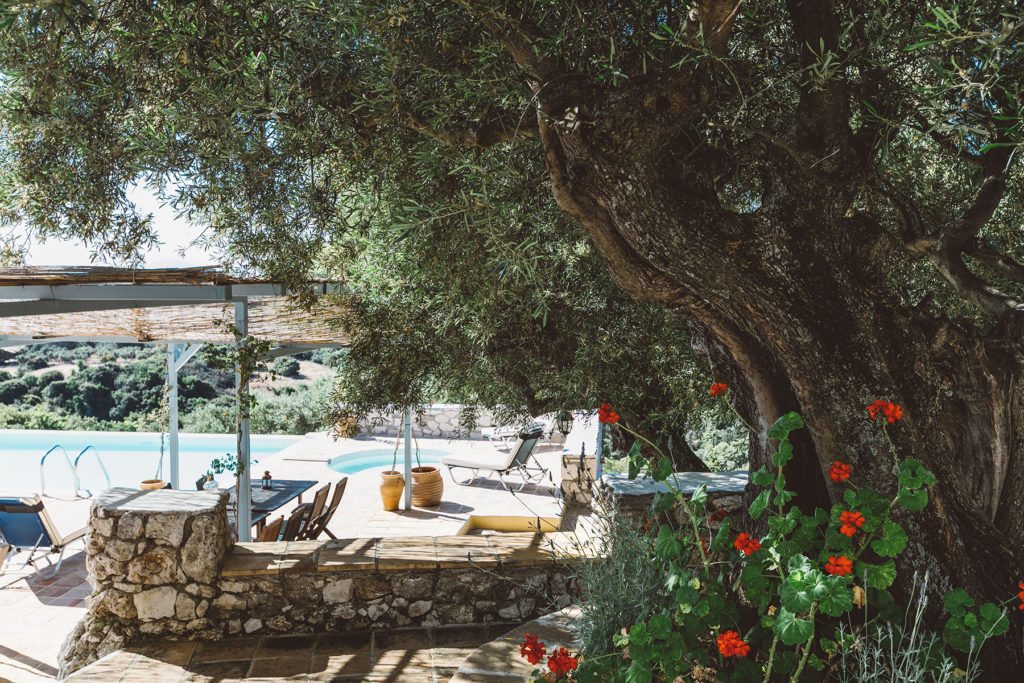 Shaded area of a luxury Greek island villa with a pool near The Peligoni Club