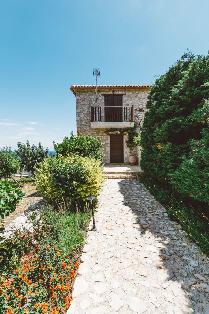 Charming rustic stone pathway to the entrance of the the Orfos villa Yria