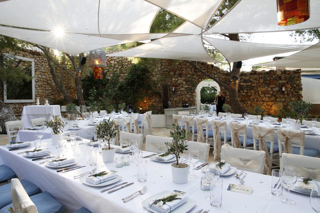 Destination wedding in Greece venue with outdoor long tables for a bespoke creative luxury wedding on an island in Greece at The Peligoni Club