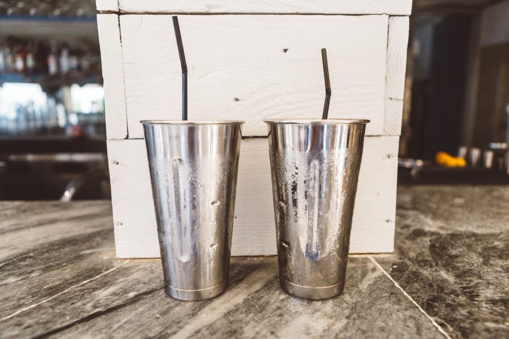 Silver Milkshake Tumblers on a marble top beach bar