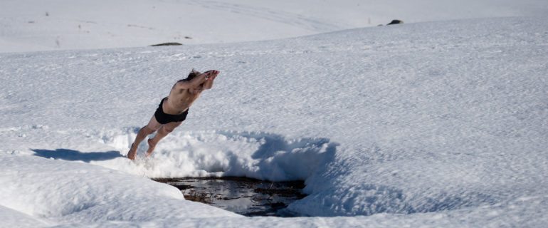 George Bullard diving into ice water