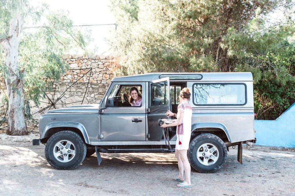 Villa Hosts get into our Landrover Defender to go up to a villa to cook a feast for our guests.