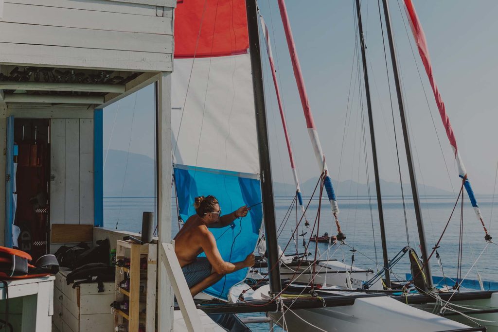 Young man working on a boat on a sunny day